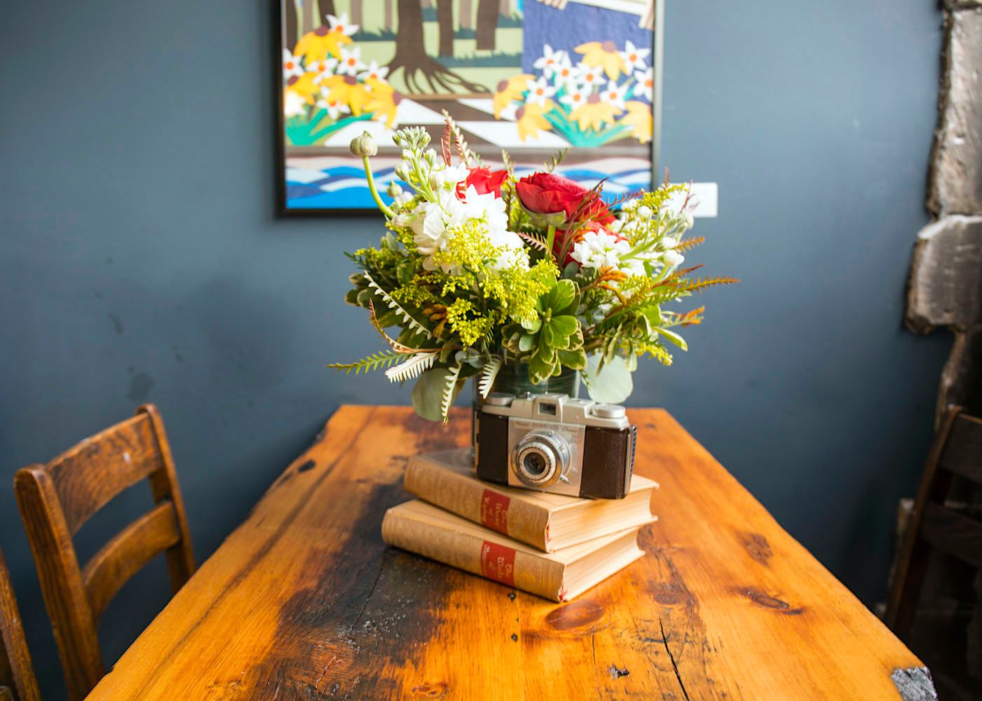 Floral centerpiece arrangement and porcelain tureens