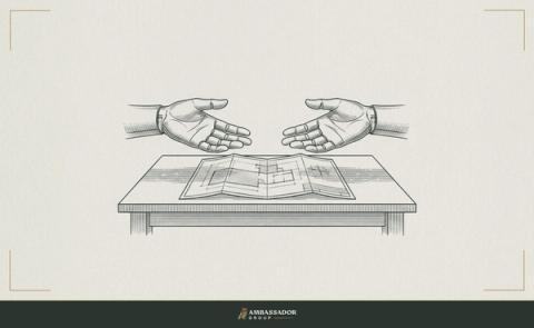 Antique engraving illustration. Two open hands facing each other across a table, both extended palm-up, with a folded blueprint laid flat between them.