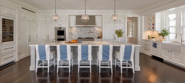 White kitchen with long island seating