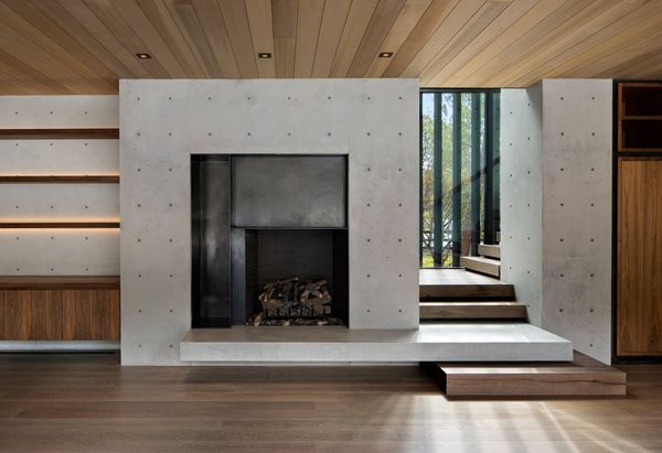 Board-formed concrete fireplace wall
