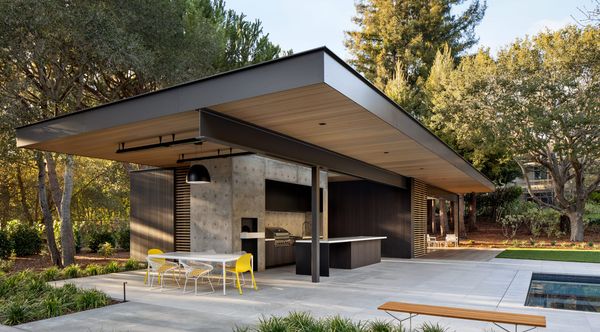 Covered outdoor pavilion beside a pool