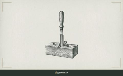 Antique engraving illustration. A deep mortise chisel driven cleanly into a single thick timber plank, shavings curled at the base, nothing else in the frame.