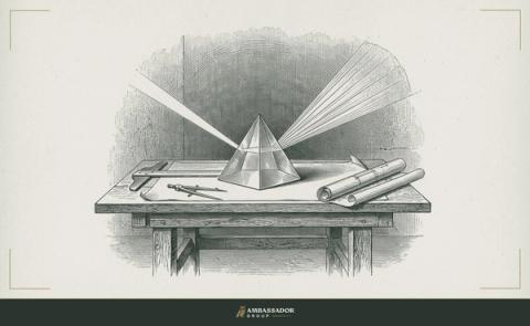 Antique engraving illustration. A prism resting on a drafting table, a single beam of light entering one face and separating into a fan of distinct rays on the far wall.