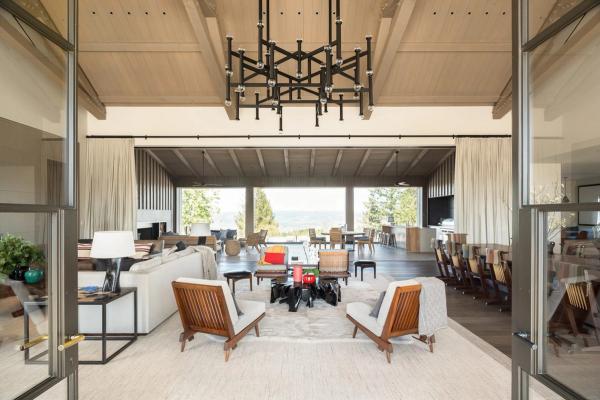 Great room under a vaulted wood ceiling