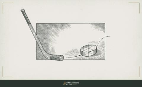 Antique engraving illustration. A hockey puck in motion etched mid-ice, a stick angled not toward the puck but toward the open space ahead where the puck is going.