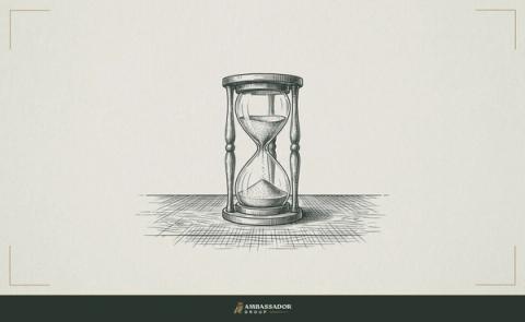 Antique engraving illustration. An hourglass with sand mid-fall standing on a scarred wooden desk.