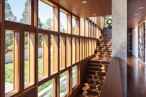 Stair beside a tall window wall