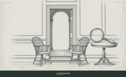 Engraving of two empty facing chairs at an open doorway with a magnifying glass on the candidate's side of the table, depicting the candidate examining the company.