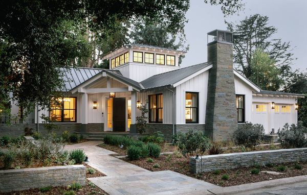 Modern farmhouse exterior at dusk