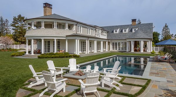 Shingle-style estate with lawn and pool