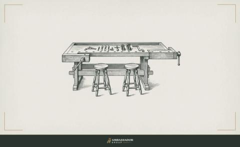Antique engraving illustration. A craftsman's workbench freshly cleared and set for a guest, tools arranged with care, a second stool drawn up to the bench alongside the first.