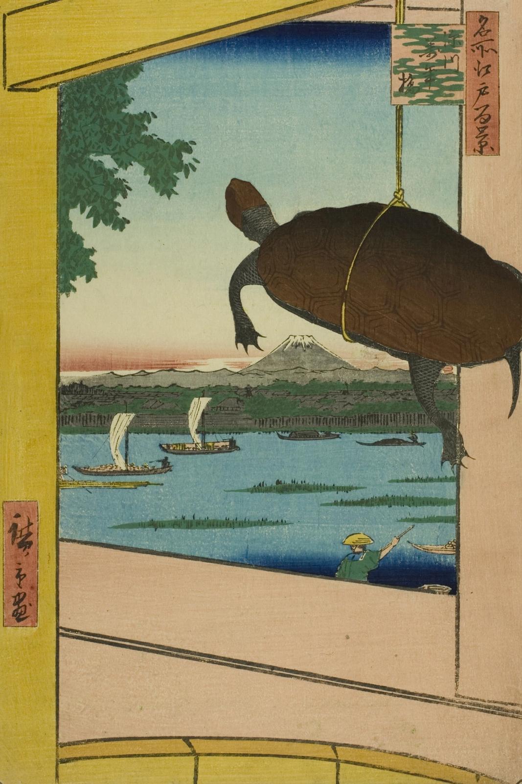 Woodblock print of a turtle hanging by a cord in the foreground with Mount Fuji and boats on the river beyond