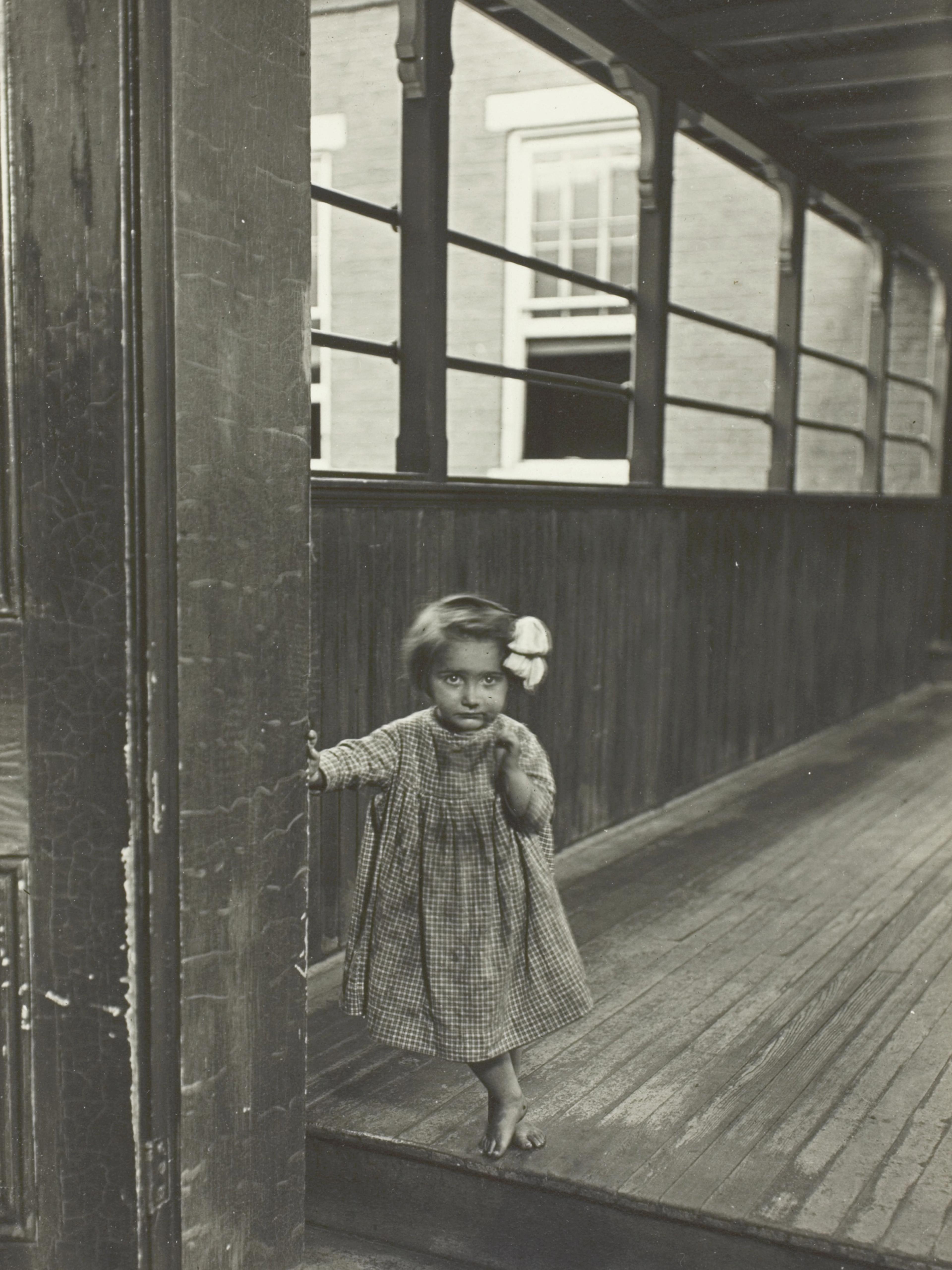 Little Girl Standing at Entrance to a Gallery