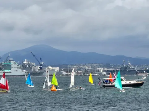 Martin 16s and Hansa 303 Sailboats near the start point of a race near Coronado bridge