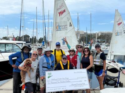 Group accepting a donation from Channel Cruising Club