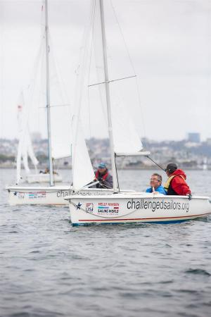 3 Martins sailing in formation with Peter and Ron's faces visible