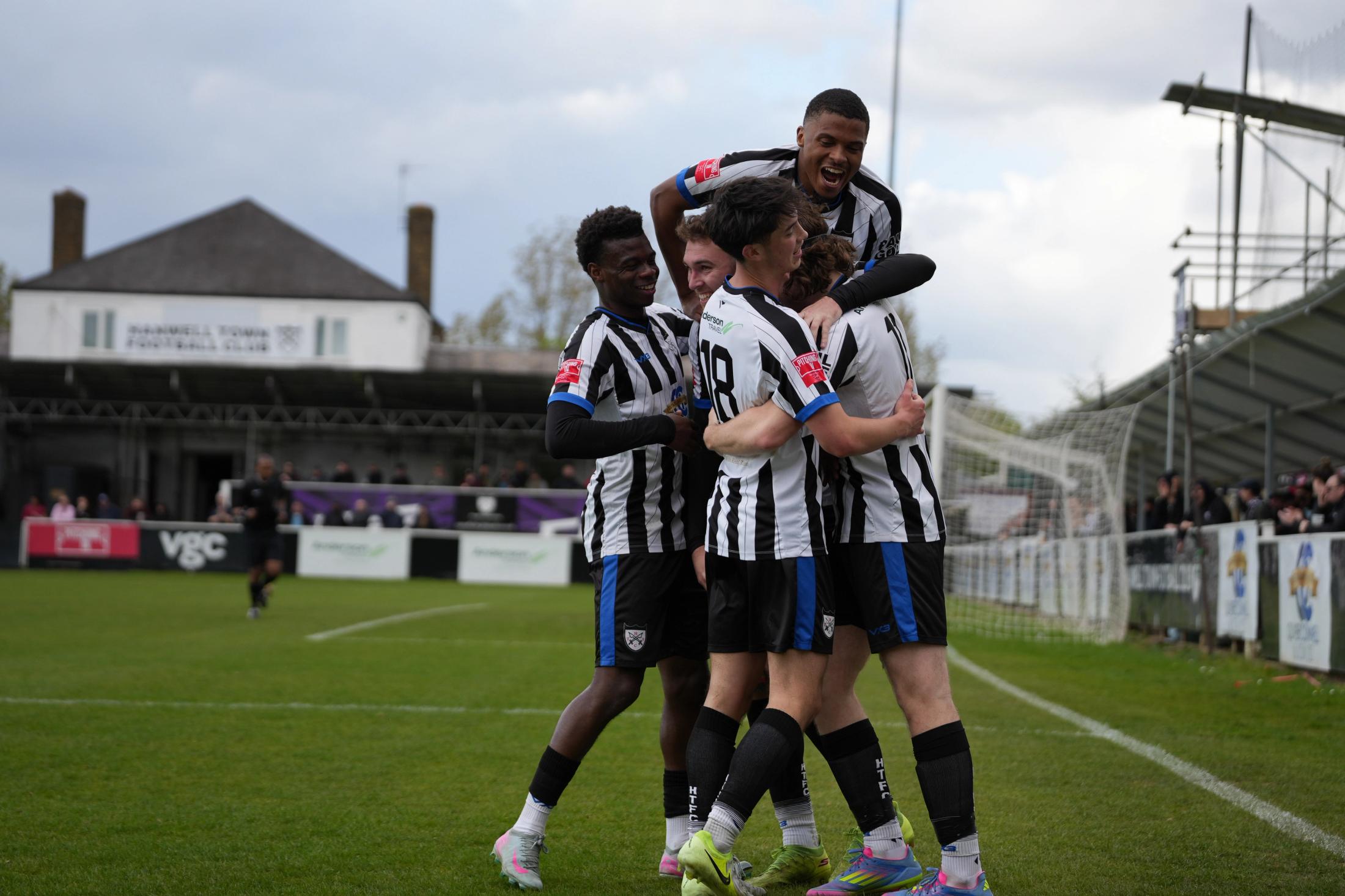 Hanwell Town players celebrating a goal at the Oliver Connell