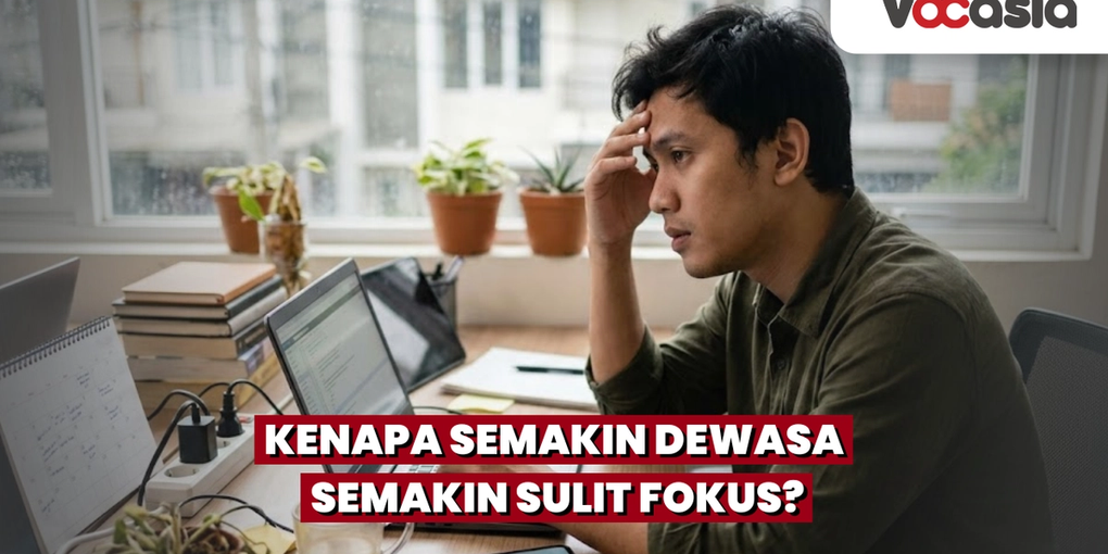 Pria dewasa yang tampak stres dan kesulitan fokus saat bekerja di depan laptop