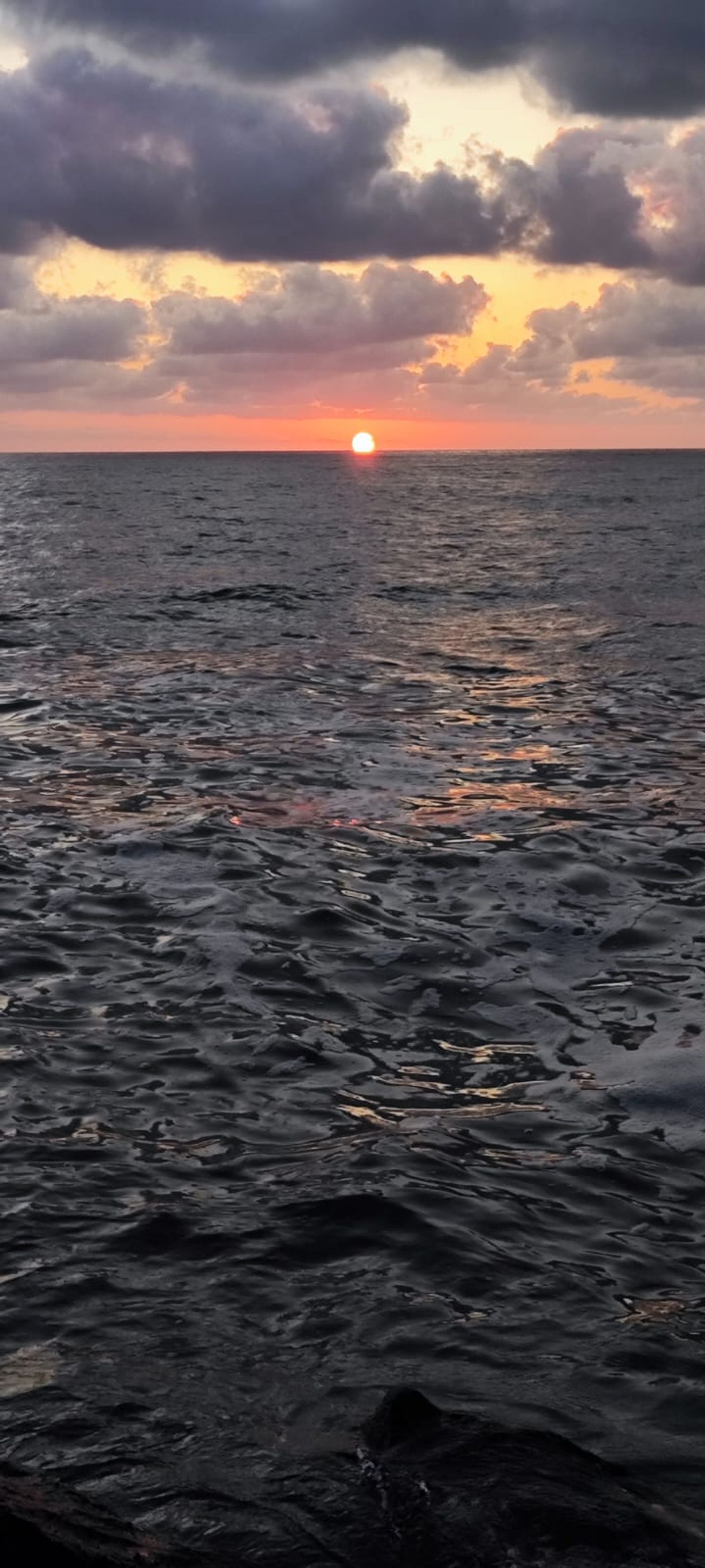 darker sea with sun