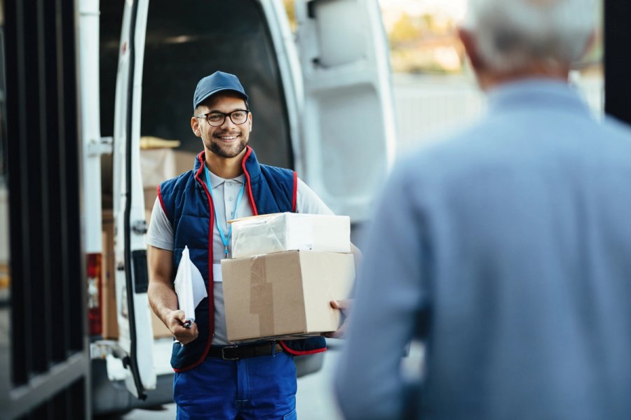 Courier delivering package at customer door