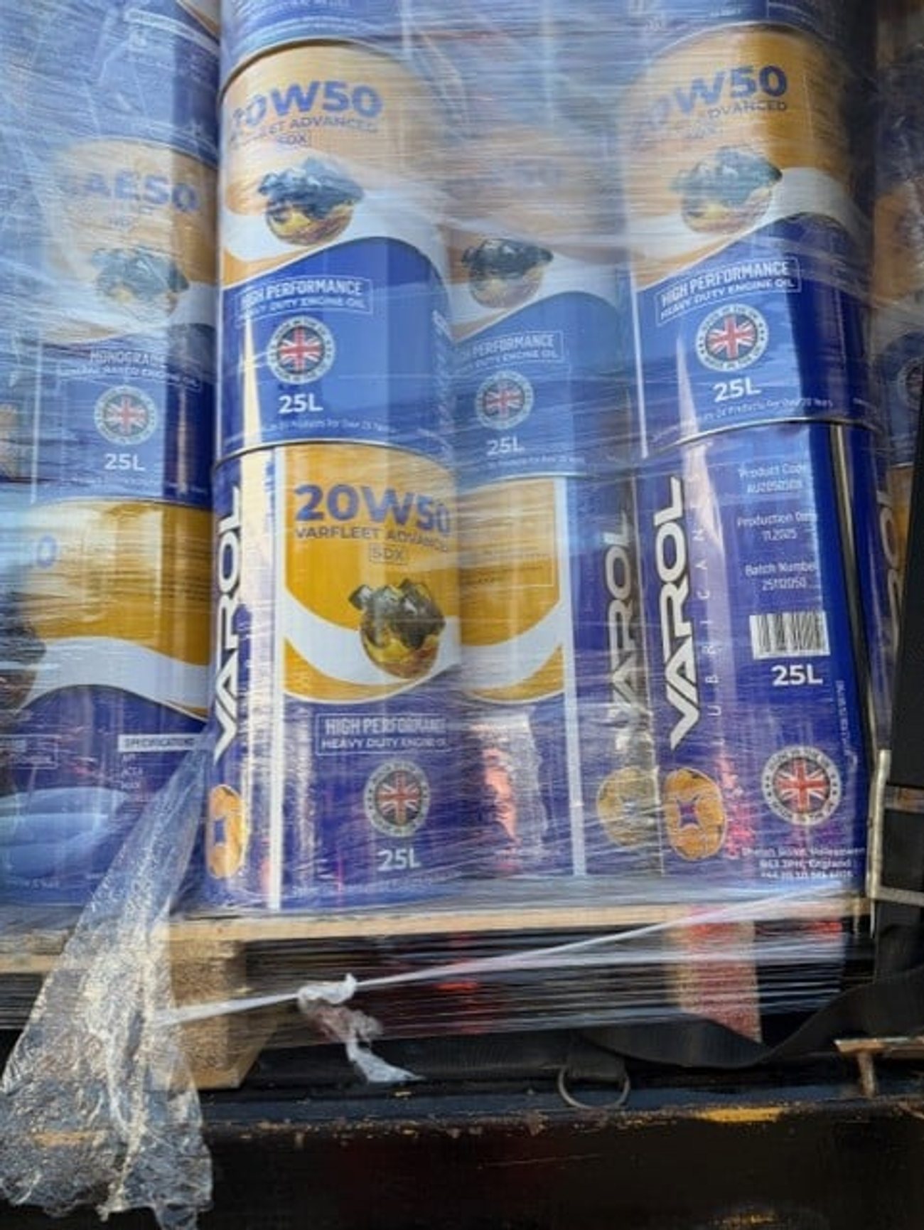 5 litre oil bottles on automated filling line at Kwikfill small pack facility Halesowen