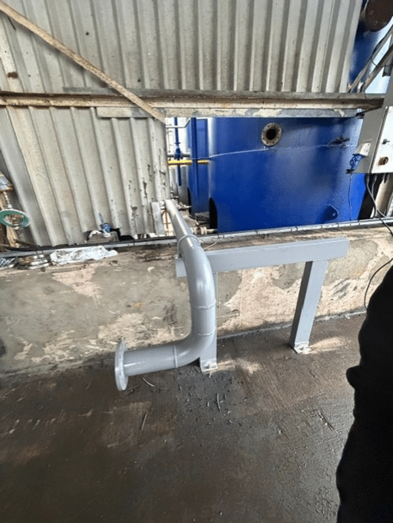 Close up of Industrial pipework system for engine oil blending vessel at Midland Oil Group warehouse