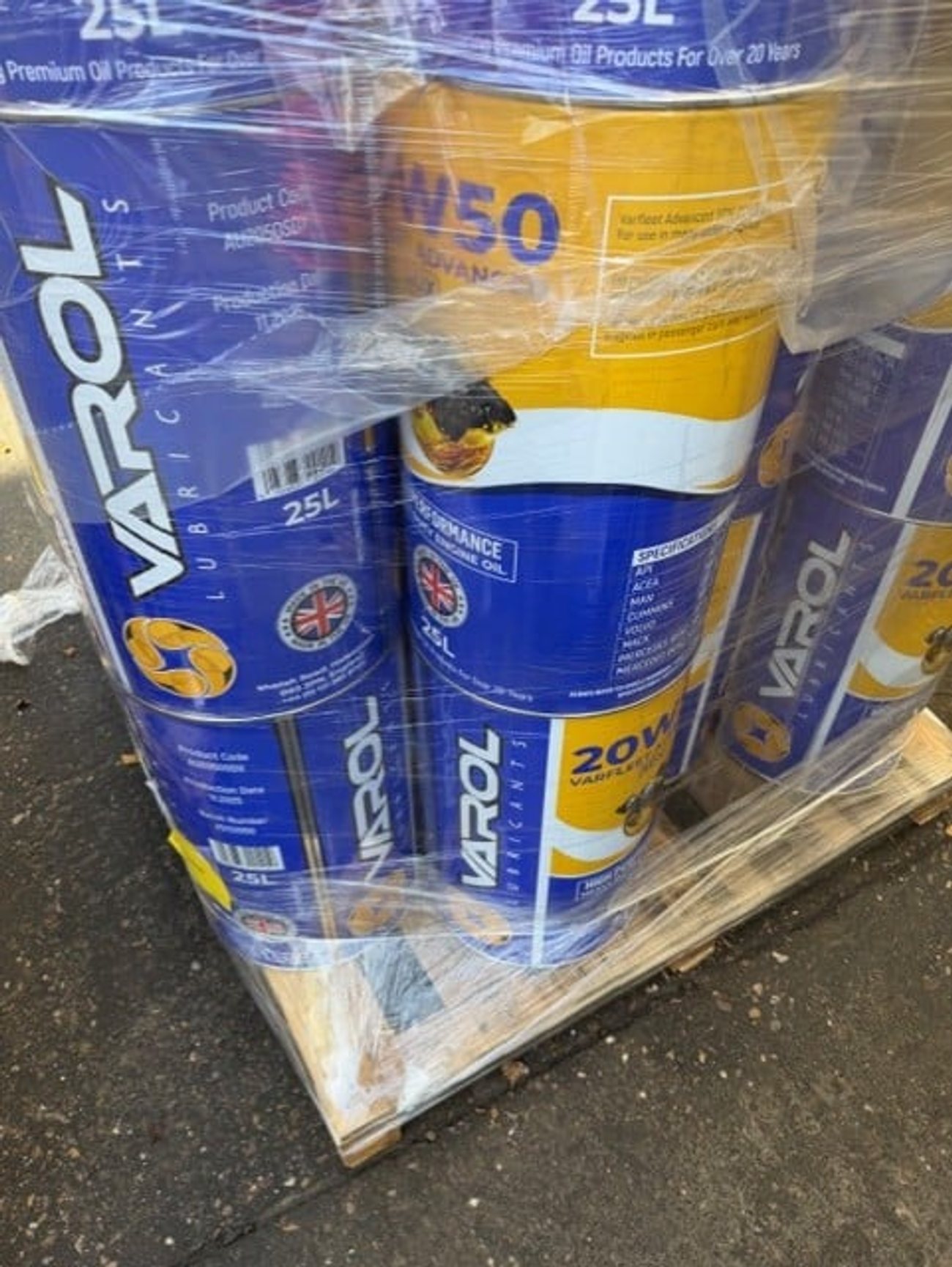 Kwikfill 5 litre oil bottles stacked on pallet at Midland Oil Group small pack filling facility