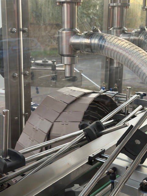 Industrial automated filling equipment for Kwikfill small pack operation at Midland Oil Group"