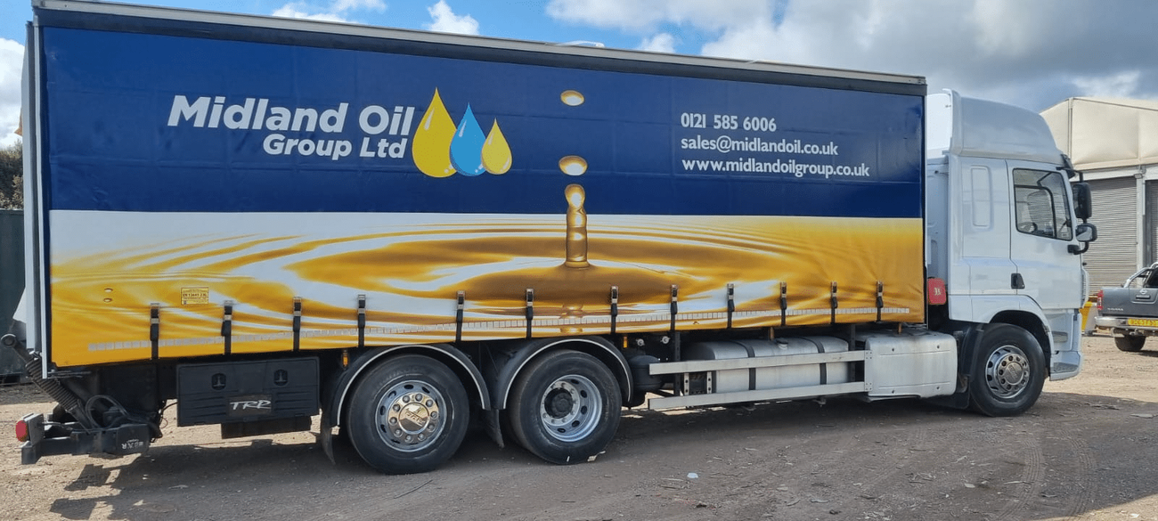 One of Midland Oil Group's newly refurbished 25-tonne rigid trucks, featuring PTO transfer system for bulk oil delivery, tail lift for local drops, and full company branding on curtains, Halesowen, West Midlands.
