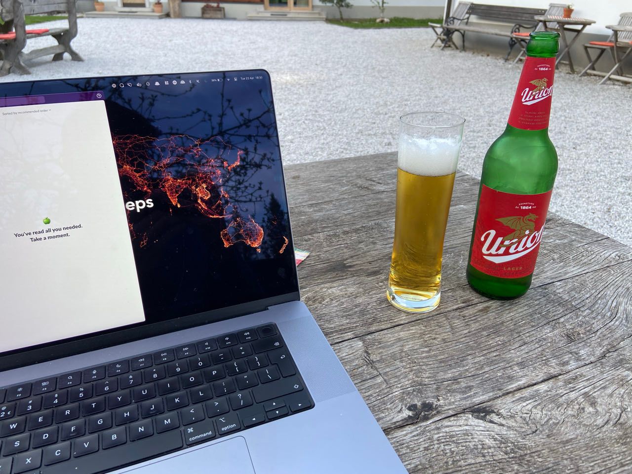 Open laptop, with a Slovenian beer next to it.