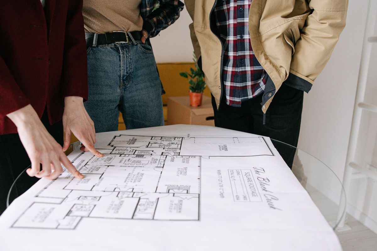 Real estate team member updating property status and project information in a content management system