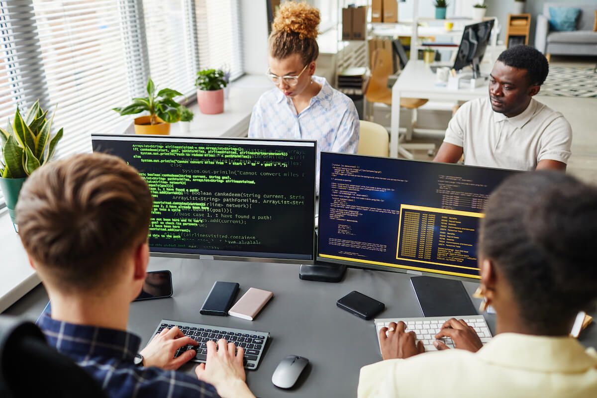 Four programmers working at same office's table