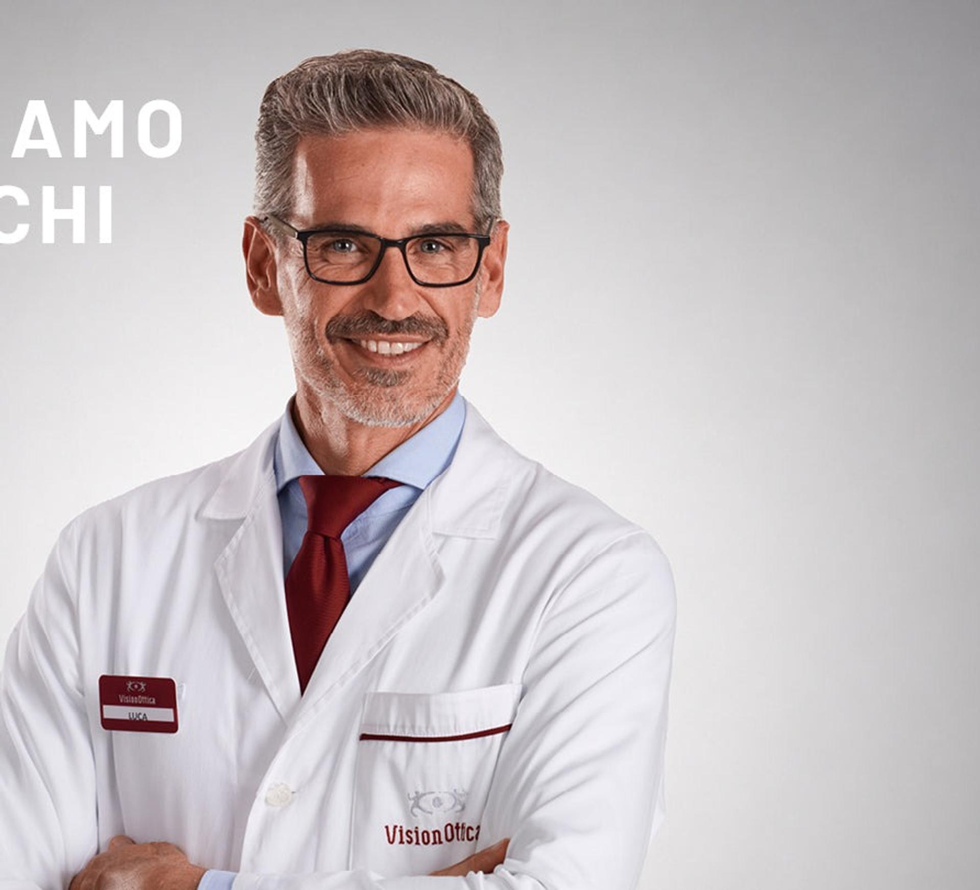 A VisionOttica optician in a white coat