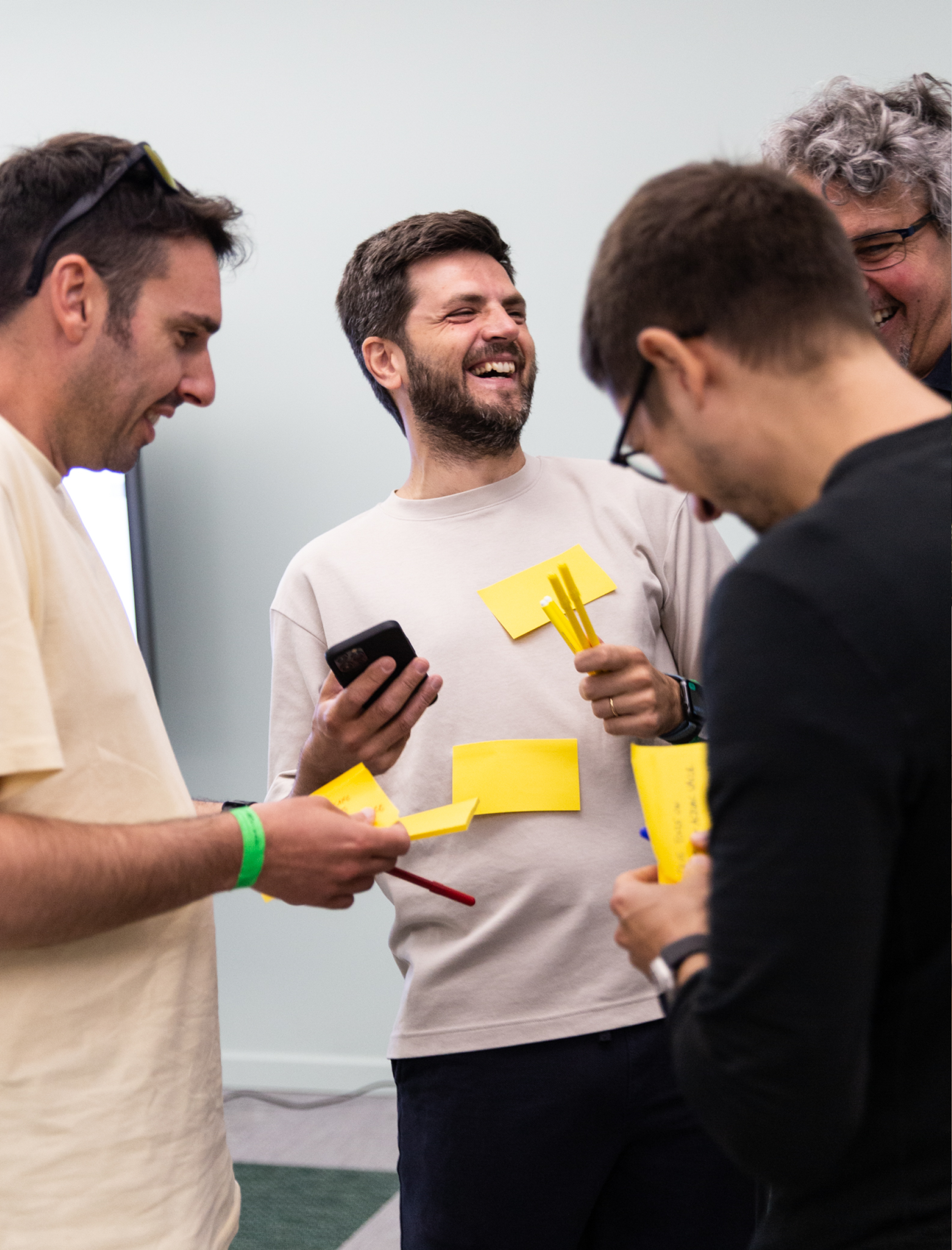 People with postit smiling