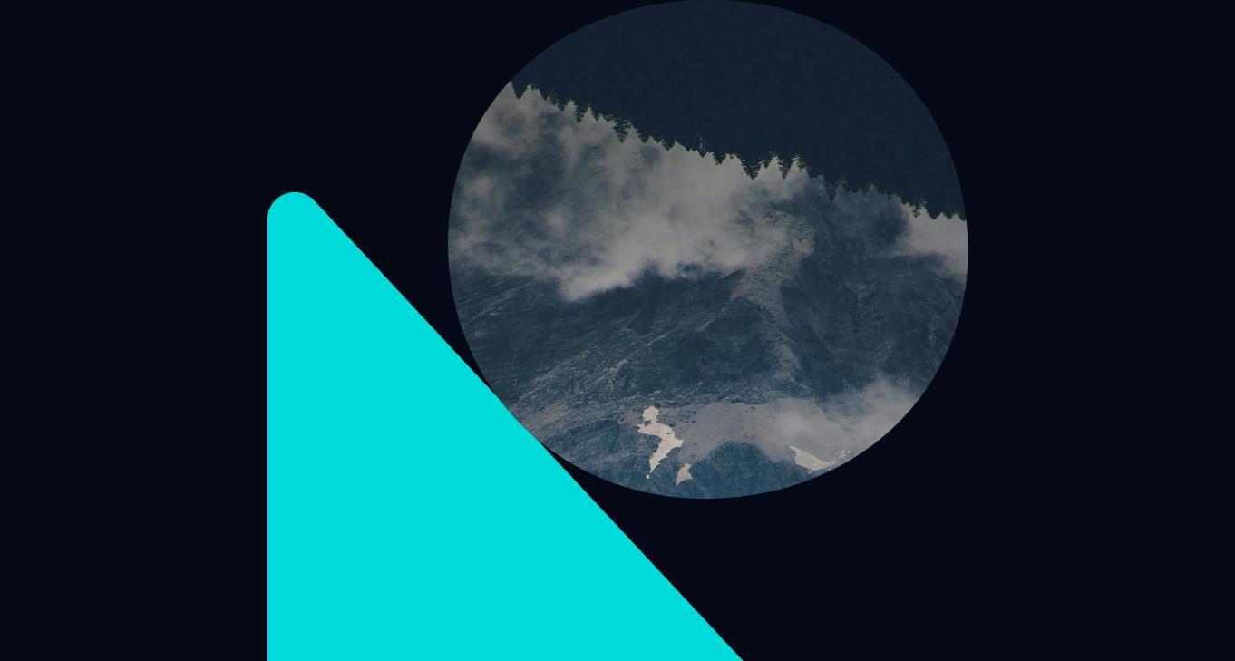 A surface ripples as a drop descends.