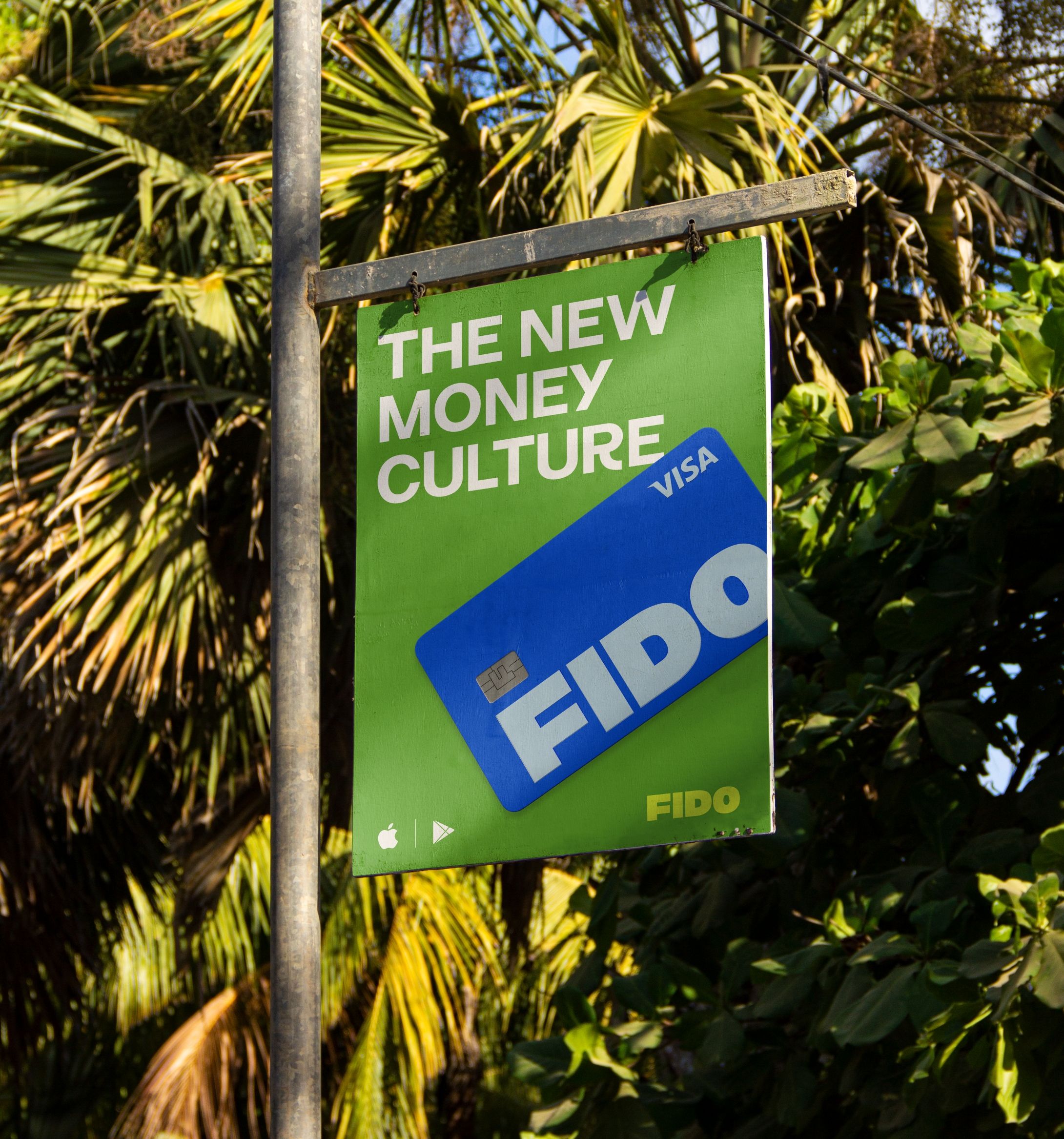 Hanging poster for Fido with trees in the background