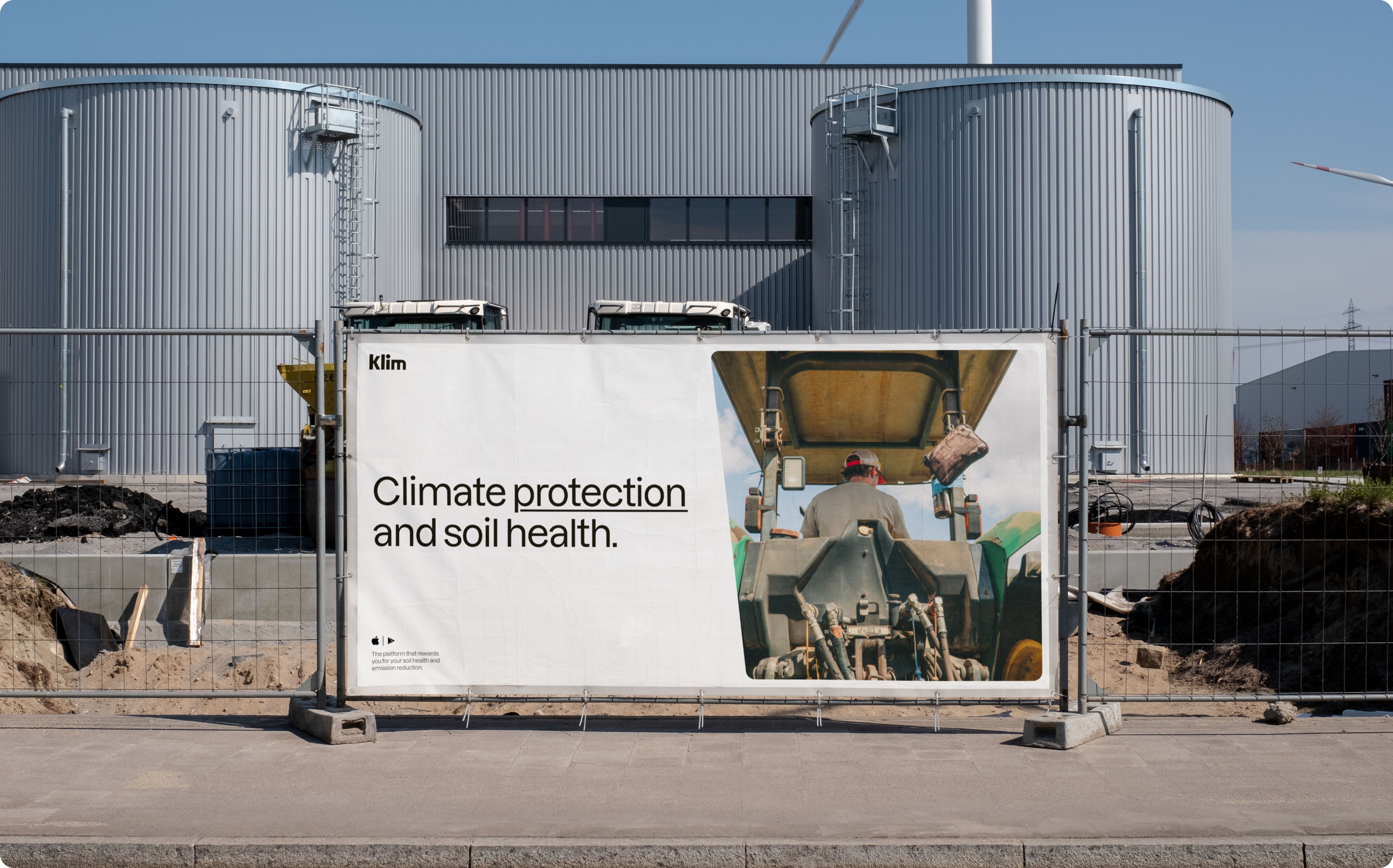 Metal fence hoarding reading 'Climate protection and soil health.'