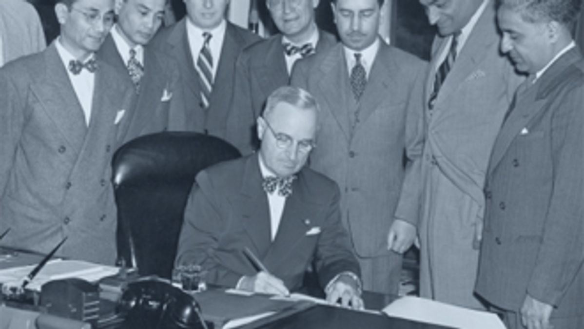 PRESIDENT TRUMAN SIGNING THE LUCE-CELLAR ACT 1946