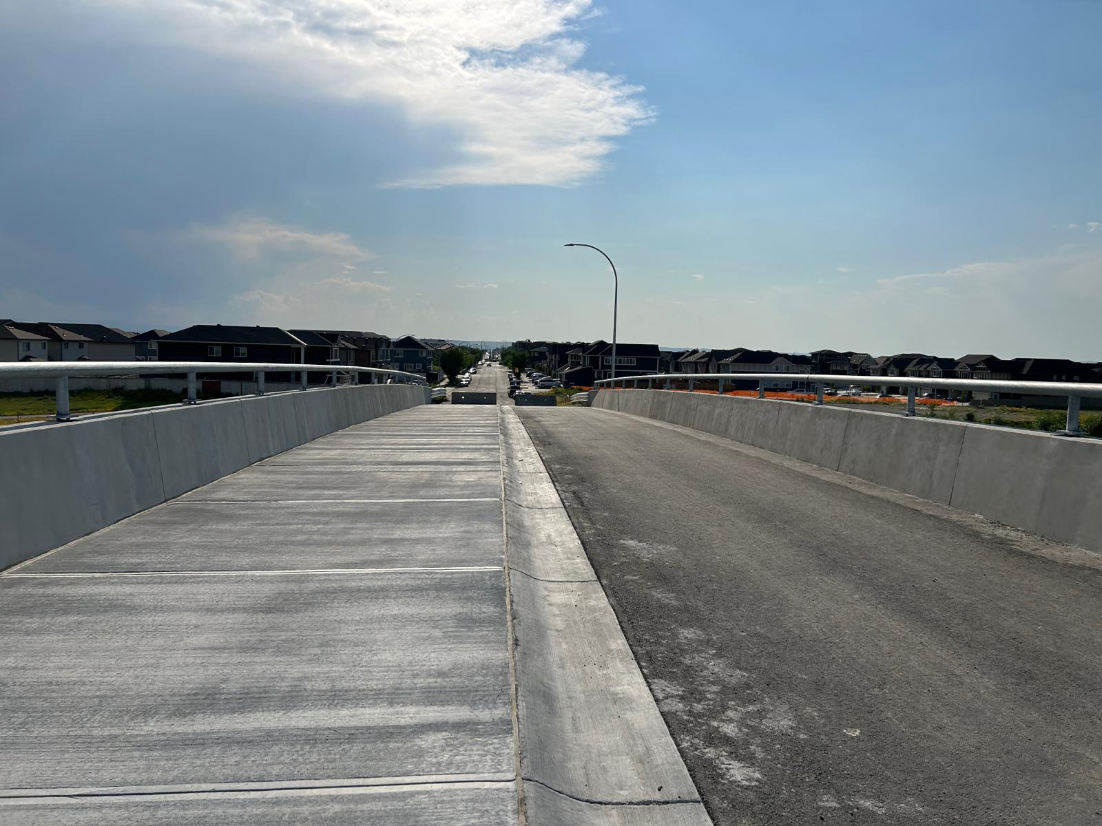 Flyover: 80 Ave NE is now complete, providing direct access for emergency services and transit to Homestead, improving community safety and connectivity.