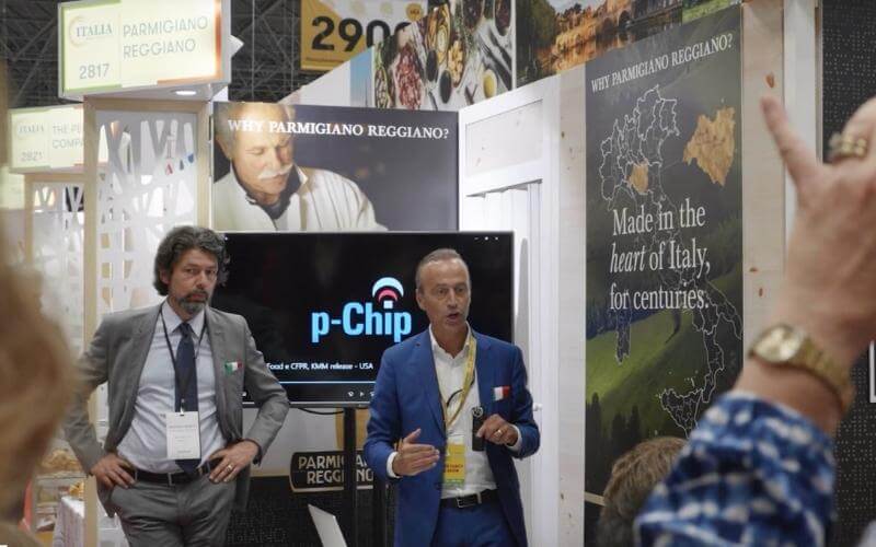 Members of Italy's Parmigiano Reggiano cheese consortium discuss a food tracing technology breakthrough