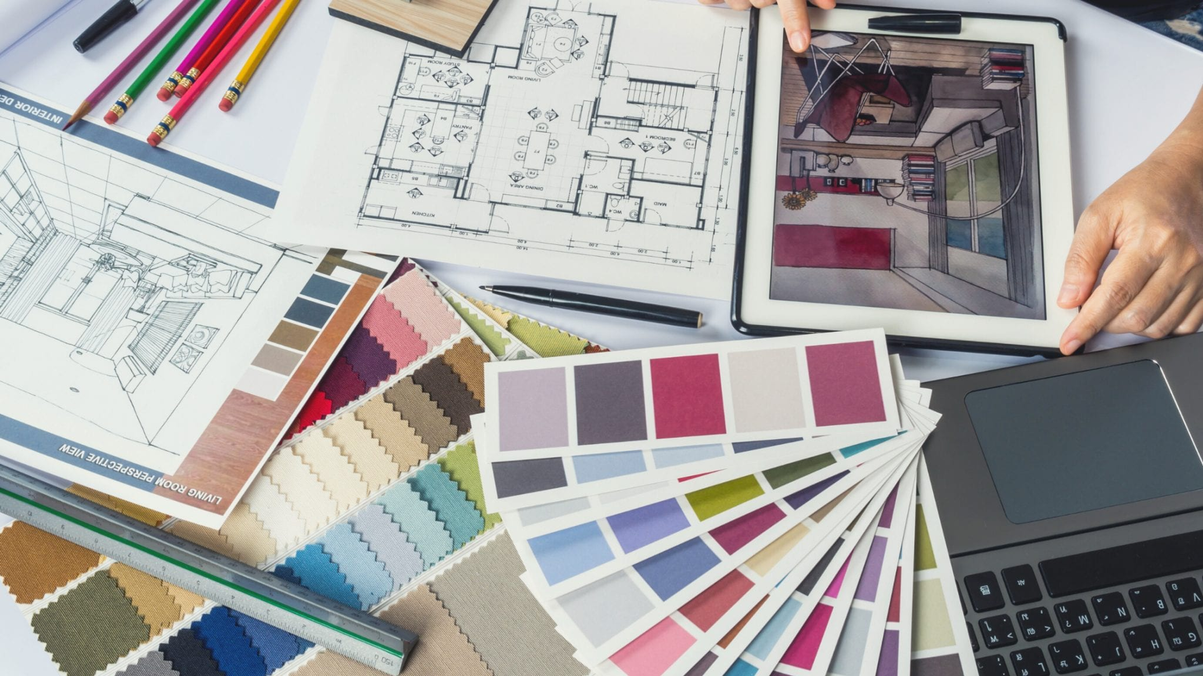 image of the desk of interior designer, with colour catalogue, layout