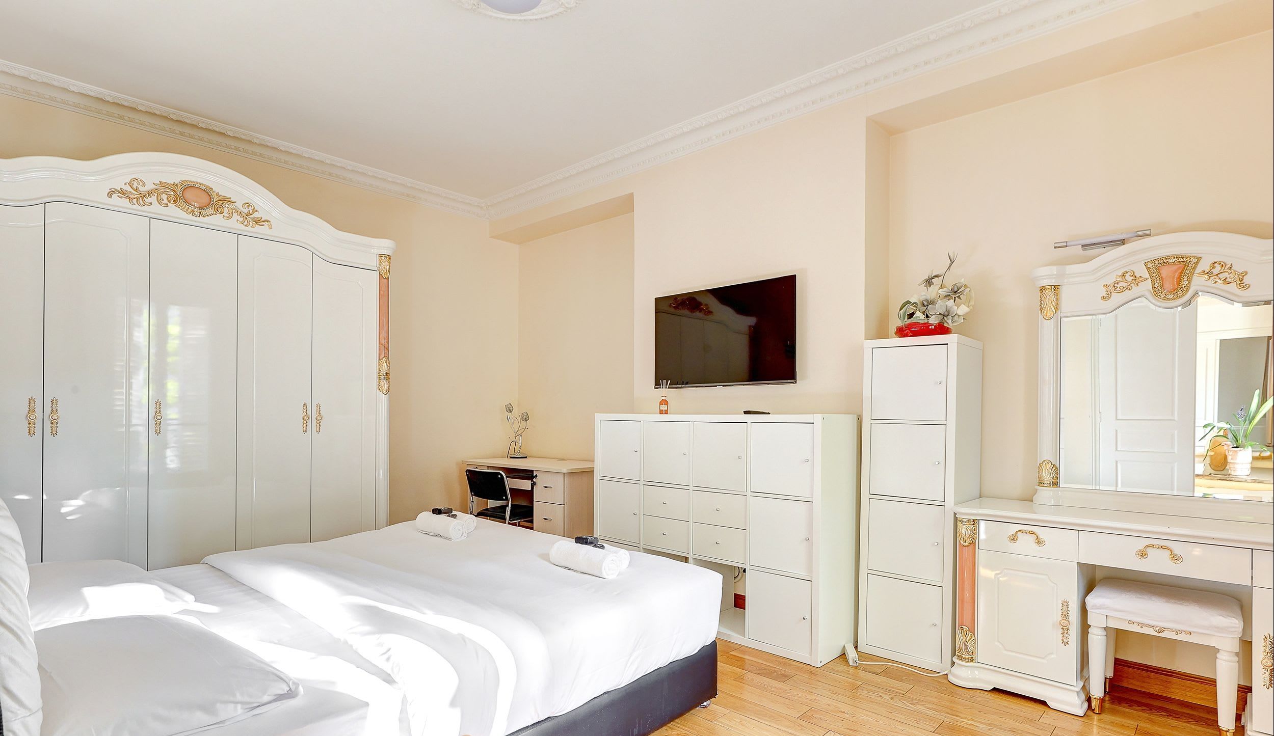 Bedroom 1: Double bed and storage space.