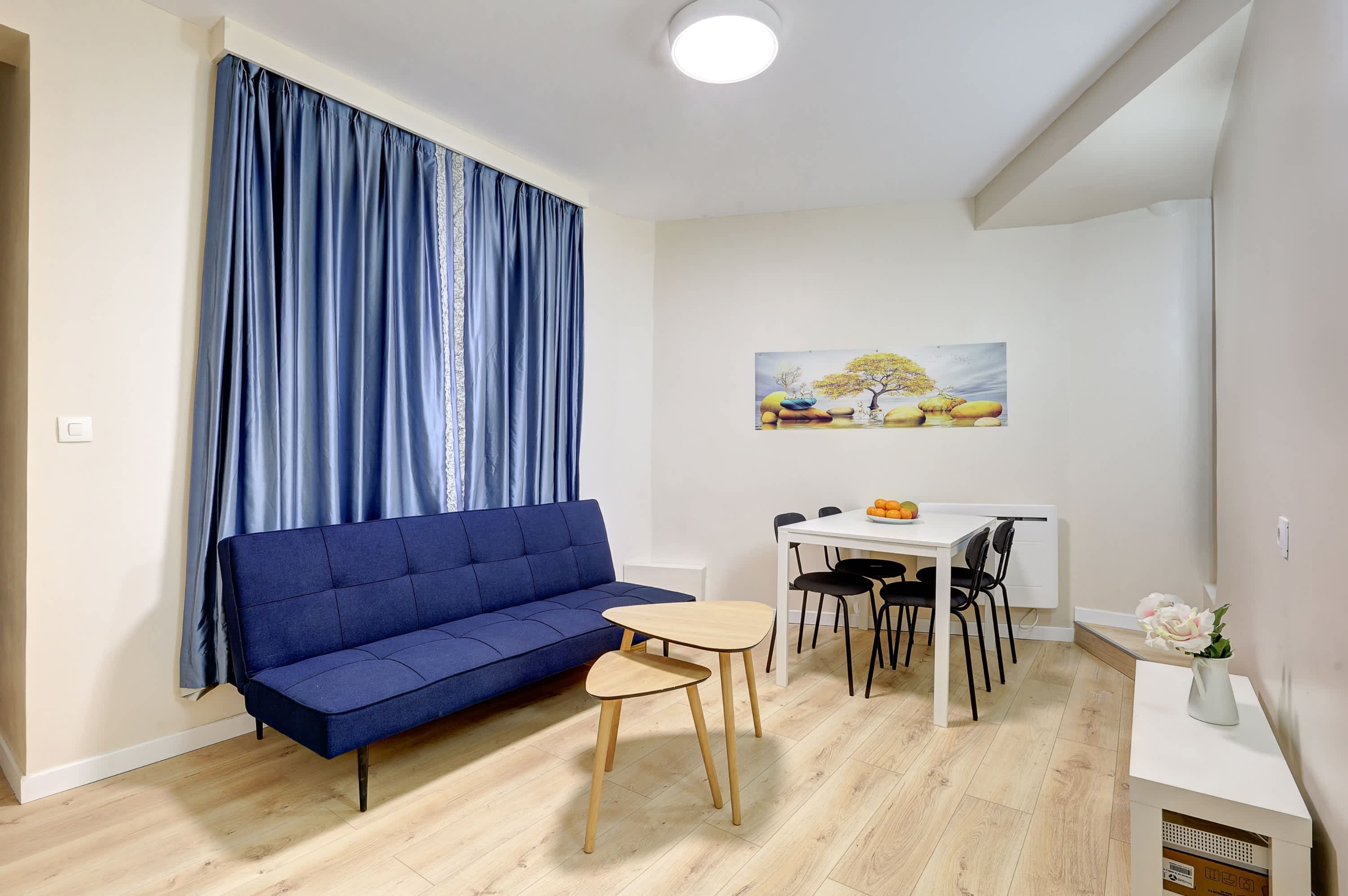 Discover a modern, minimalist living room, where clean lines and elegant design create the perfect space to relax.