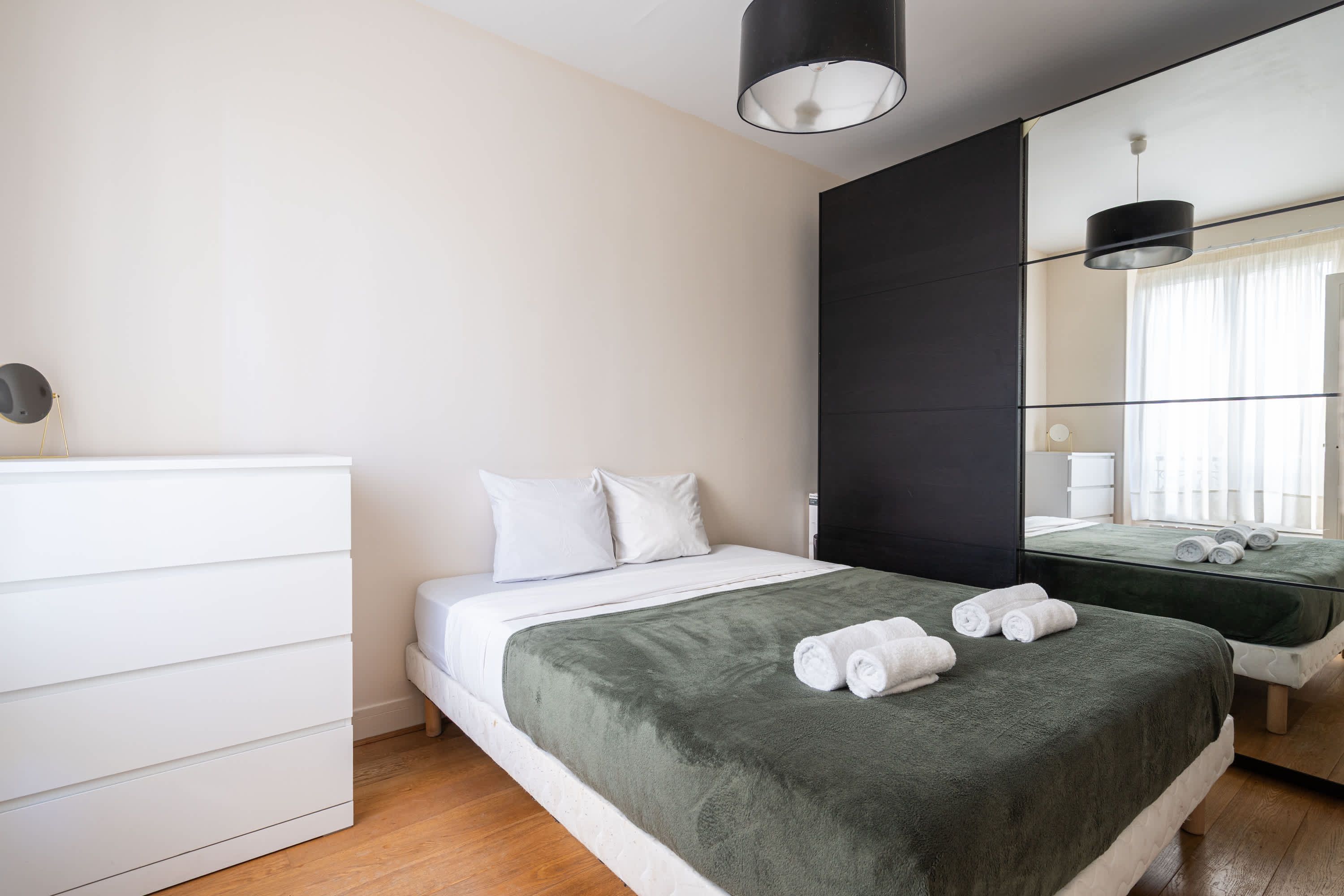 Elegant Parisian apartments with bright living areas, cozy bedrooms, and fully equipped kitchens.
