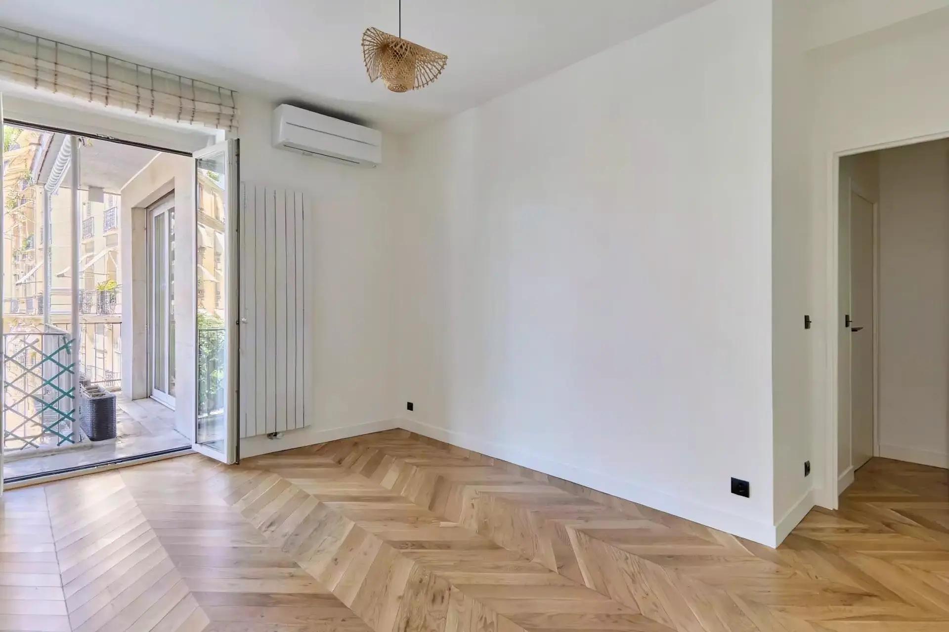Bright fully furnished Paris apartment with elegant interiors, spacious living areas, balcony access, and comfortable amenities.