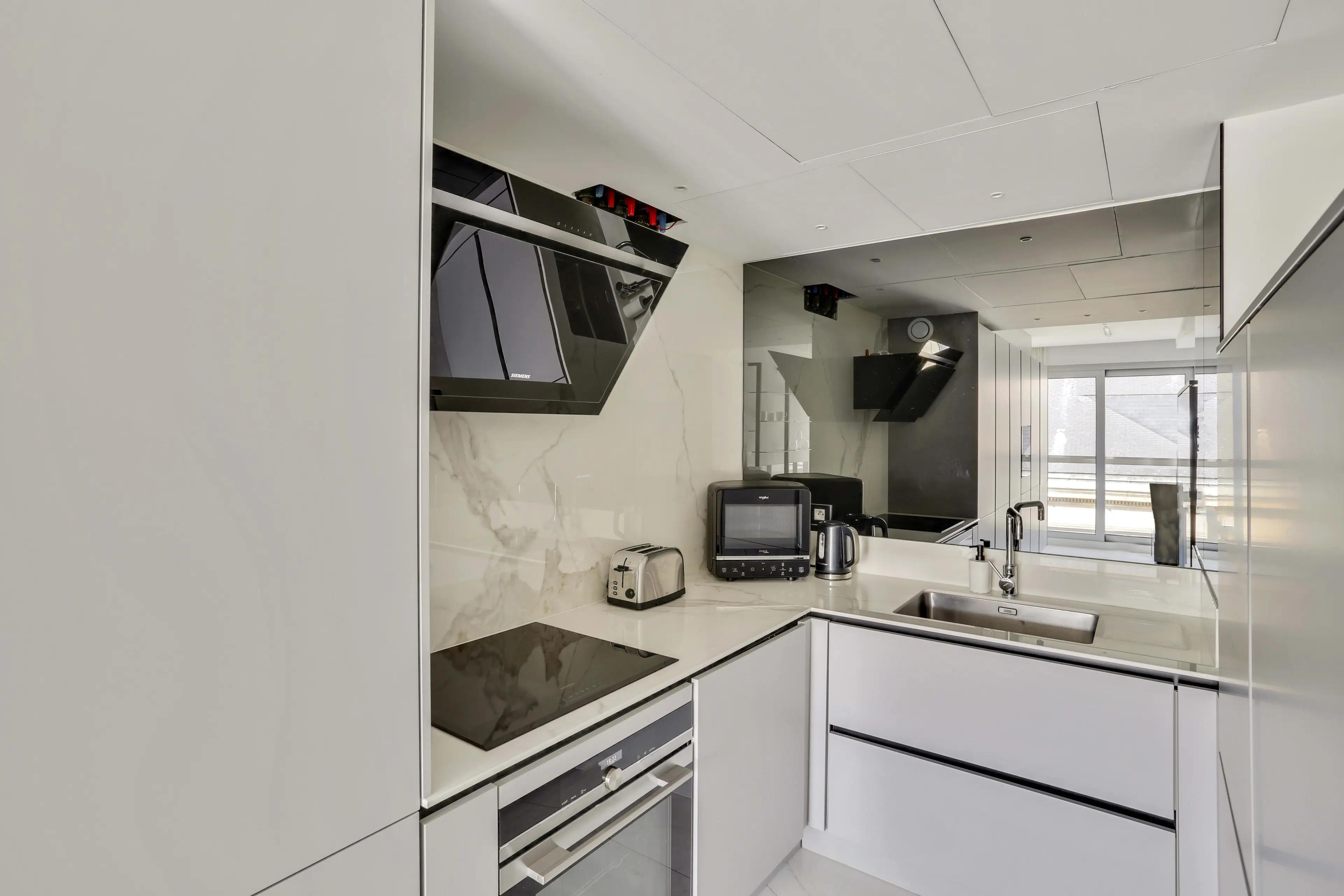 Renovated 4-bedroom duplex apartment for rent in Paris 7th arrondissement, bright living room with wraparound balcony and Paris rooftop view