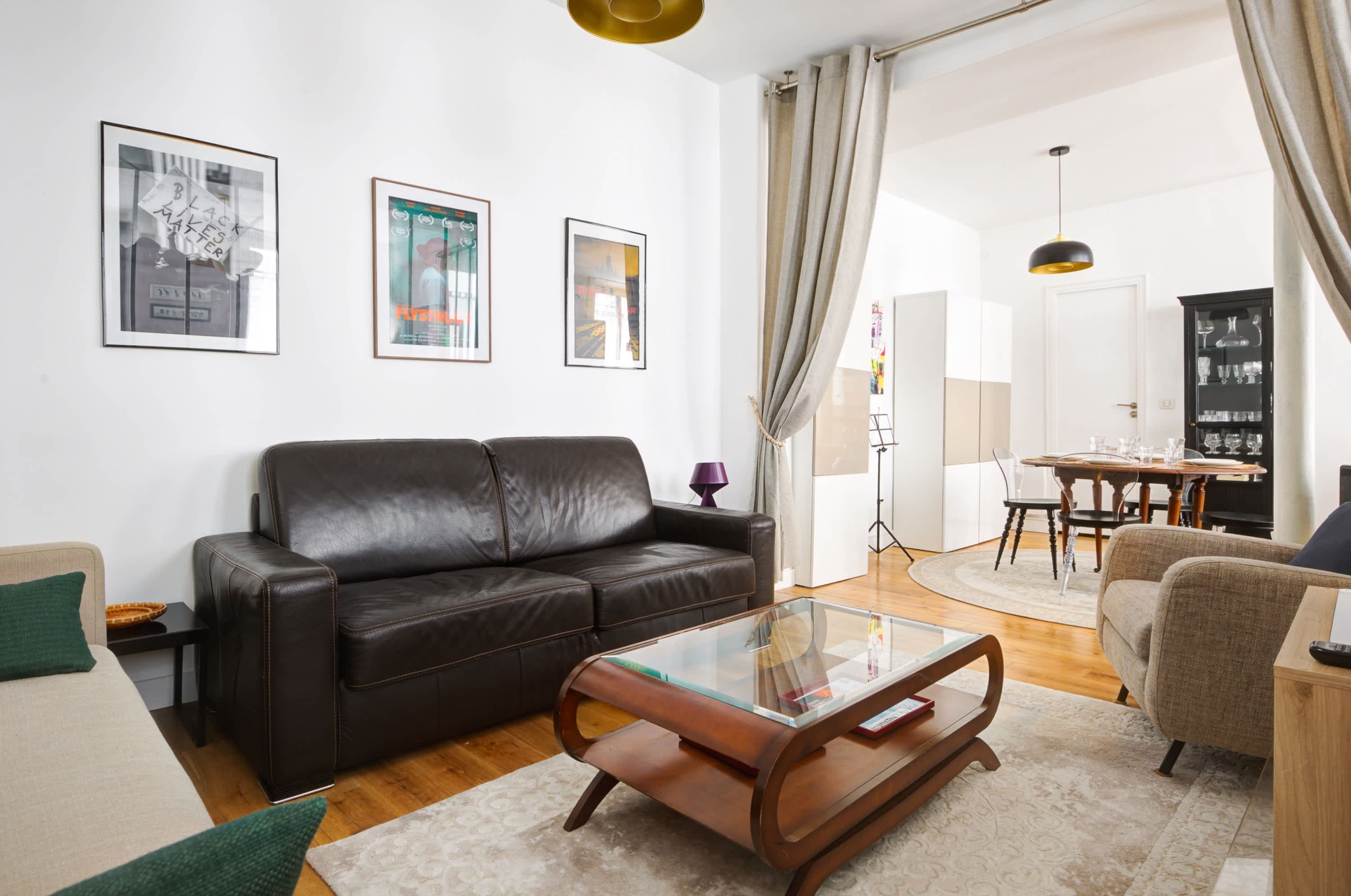Bright living room with sofa bed and a warm, cozy atmosphere