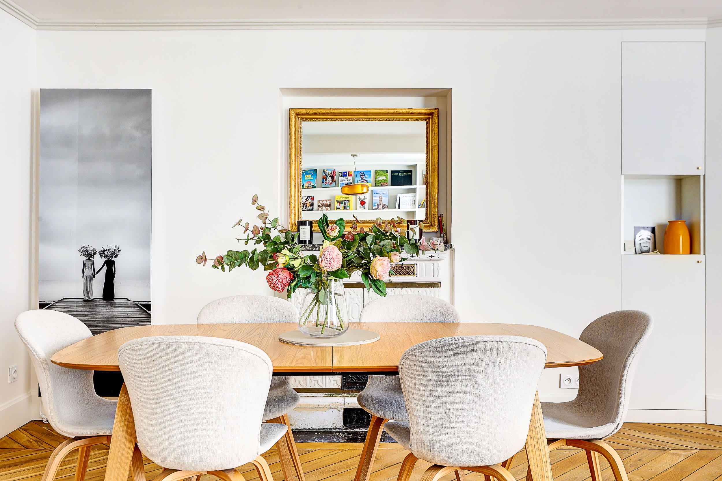 Bright and spacious living area with a sofa bed and dining space.