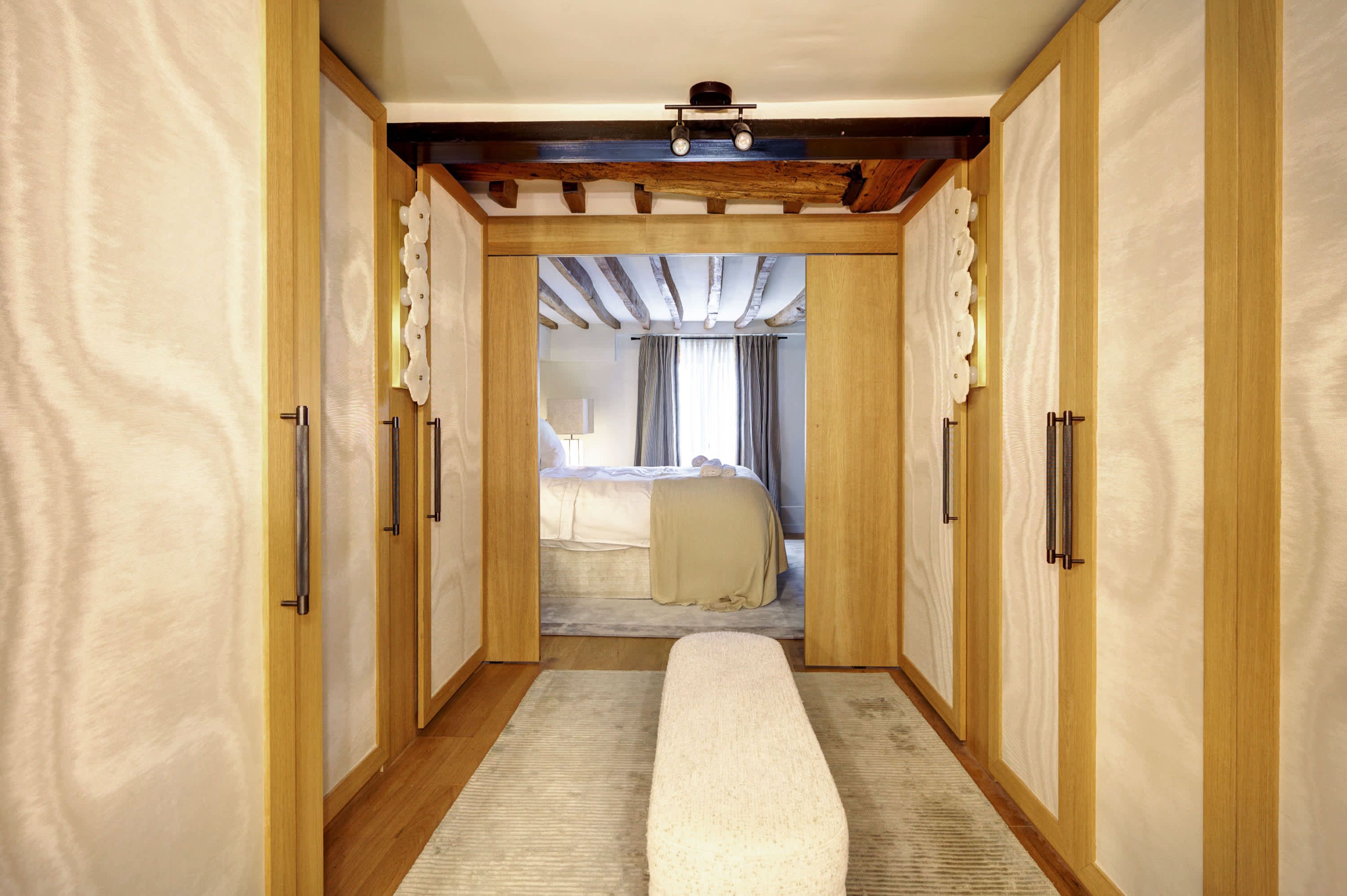 Bedroom 1: features a 160 × 200 cm double bed, storage space, and complimentary welcome amenities.
