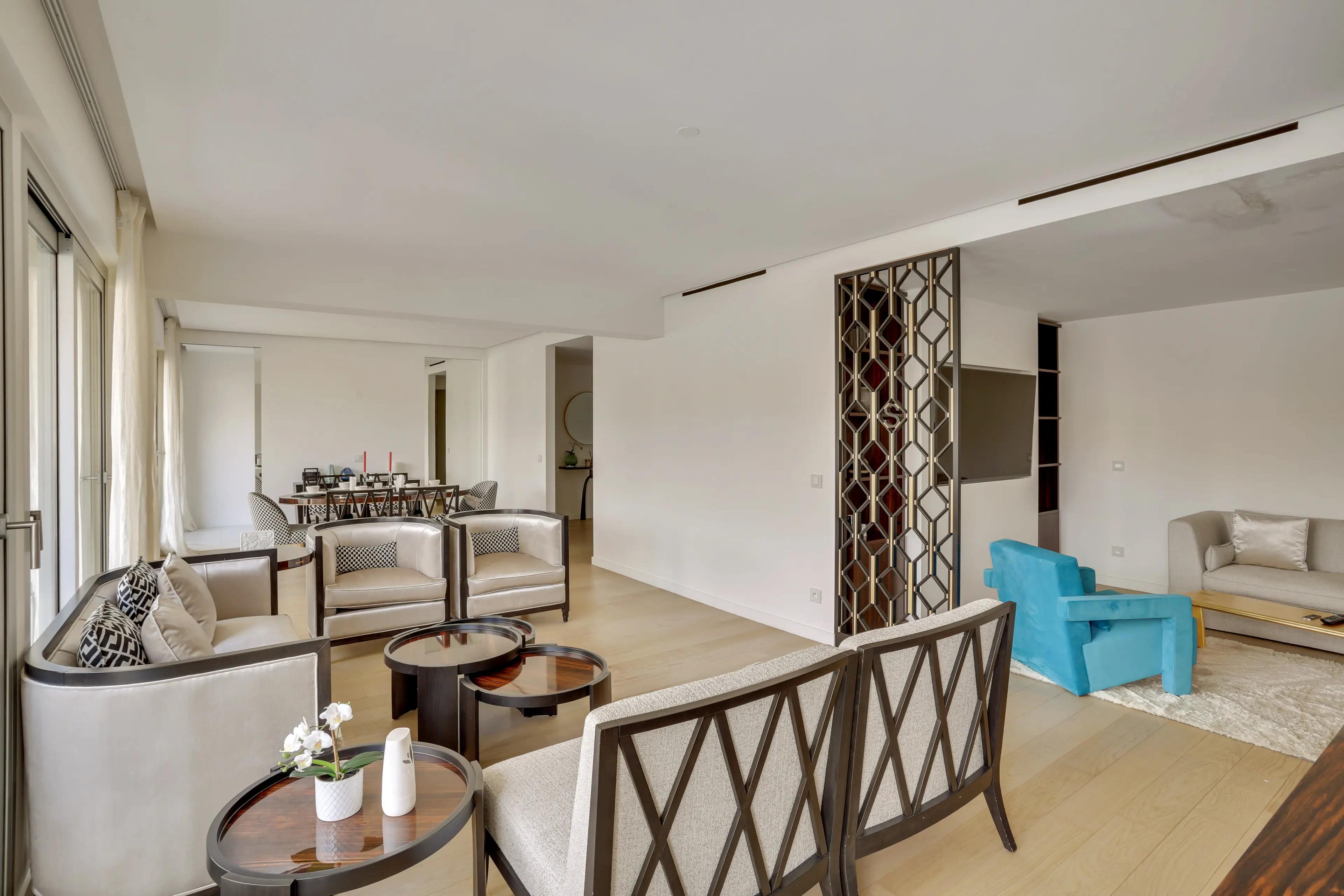 Renovated 4-bedroom duplex apartment for rent in Paris 7th arrondissement, bright living room with wraparound balcony and Paris rooftop view